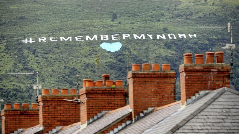 Remember My Noah written in huge white letters on Black Mountain overlooking Belfast. Picture by Mal McCann 