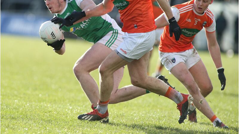 Armagh pair Brendan Donaghy and Aaron McKay keep a tight eye on Fermanagh's Tom Clarke during Saturday's clash in Crossmaglen. Picture by Hugh Russell