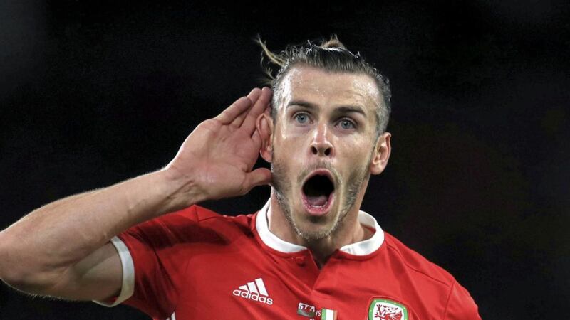 Wales&#39; Gareth Bale celebrates scoring against Republic of Ireland last month. The Real Madrid star will miss tonight&#39;s return meeting in Dublin 