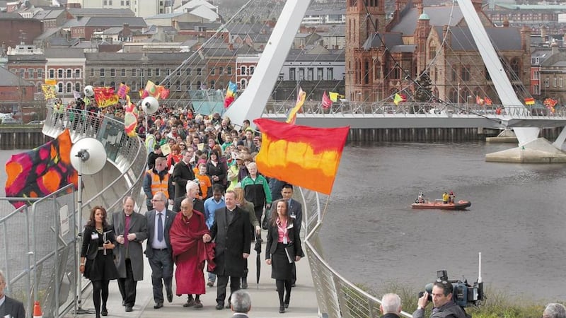 The Dalai Lama crosses the Peace Bridge in Derry in 2013. The bridge project was the recipient of EU peace funding. Picture by Margaret McLaughlin 