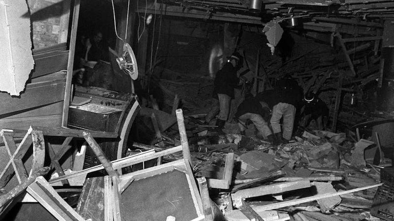 Firemen searching through debris in the heart of Birmingham in November 1974 after a bombing outrage in which two pubs were blitzed. Picture by PA Wire