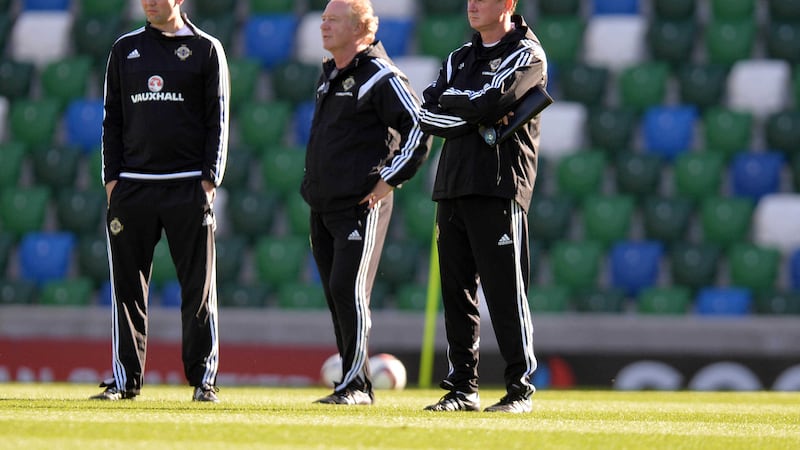 Michael O'Neill, right, watches on as Northern Ireland train for their crunch Euro 2016 qualifier against Greece