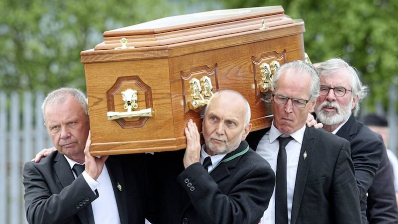 Sean Hughes, Sean Murray, Gerry Kelly and Gerry Adams carry the coffin of Bobby Storey on Tuesday. Draft regulations circulated after the funeral recommend that coffin 'lifts' should not take place unless pallbearers all reside in the same house. Picture by Mal McCann