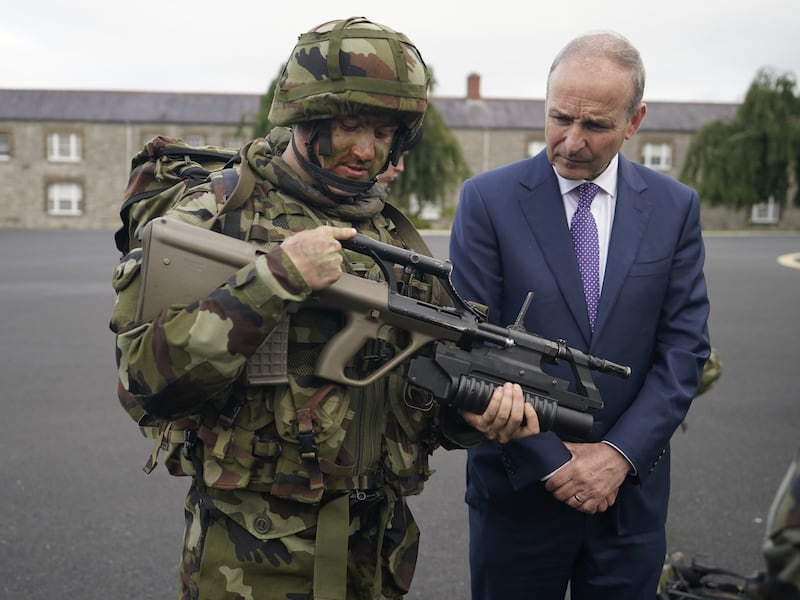 Tanaiste Micheal Martin, speaks to a member of the armed forces during the launch of the Reserve Defence Forces Regeneration and Development Plan at Cathal Brugha Barracks, Dublin (Niall CarsonPA)