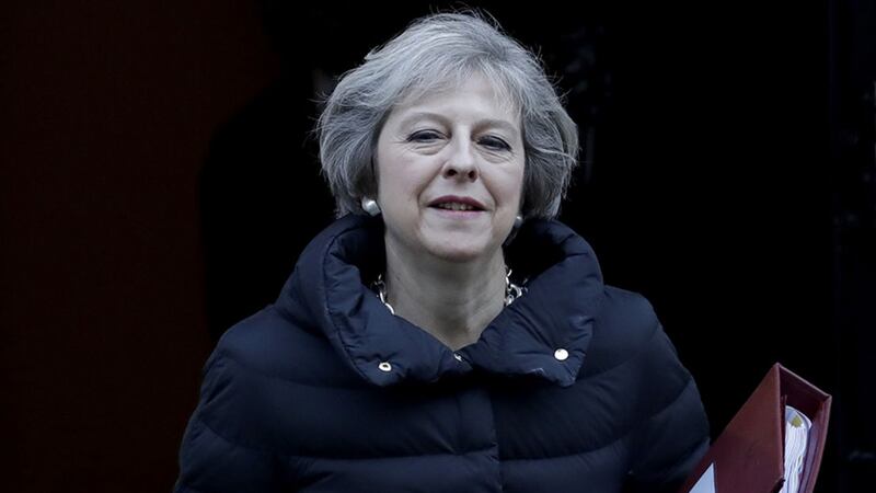 British Prime Minister Theresa May holds a folder as she leaves 10 Downing Street in London, to attend Prime Minister's Questions at the Houses of Parliament, Wednesday, January 18, 2017&nbsp;