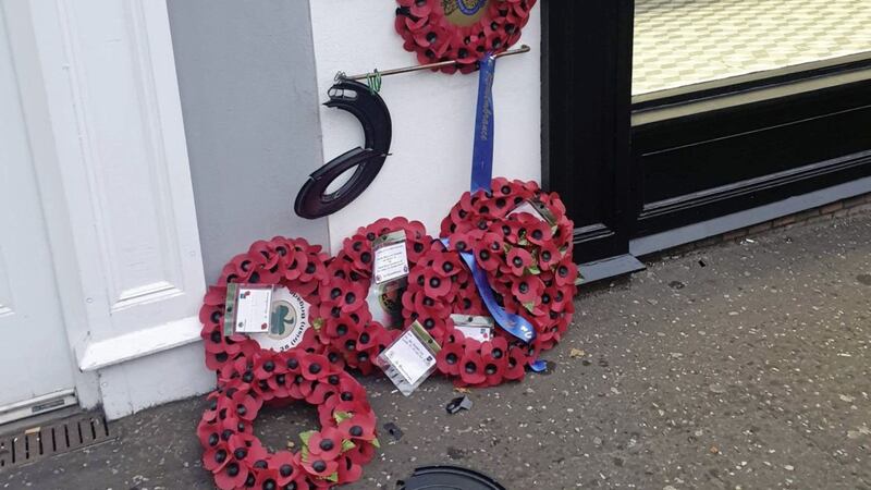 Poppy wreaths laid in memory of six soldiers killed in a 1988 bomb attack in Lisburn have been vandalised Picture by Sir Jeffrey Donaldson/PA 