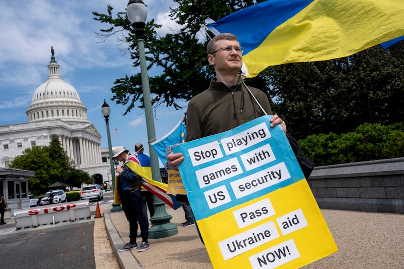 Activists supporting Ukraine, demonstrate outside the Capitol in Washington (J Scott Applewhite/AP)