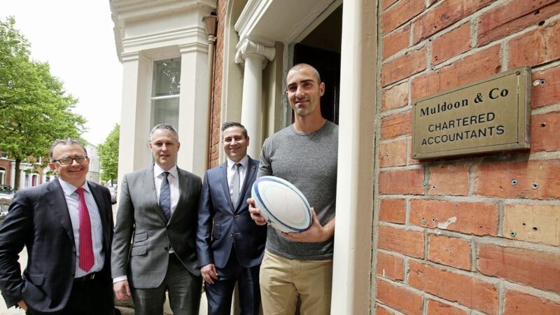 Muldoon &amp; Co partners Sean Muldoon, Raymond Tiffney and Robbie Barr with their client Ruan Pienaar, the South African rugby star who will leave Ulster this summer to take up a three year contract with French Top 14 side Montpellier 