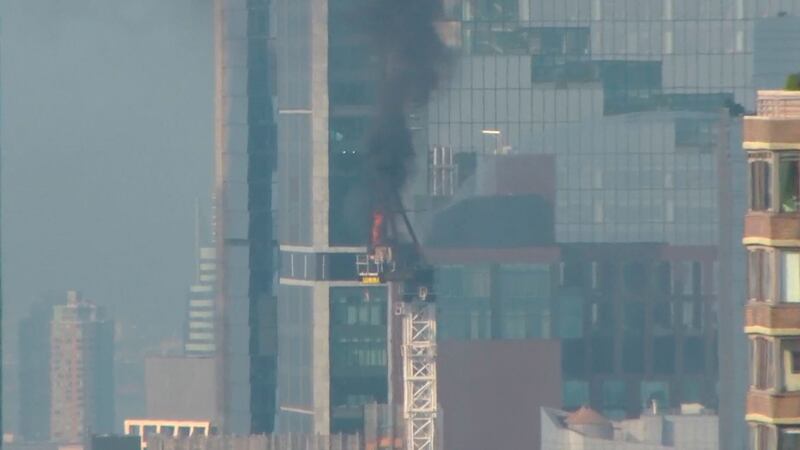 Emergency services battle a crane fire in Manhattan, New York (WABC/AP)