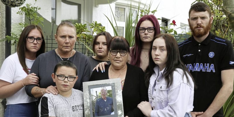 Kay Conlon and daughter Geraldine with family at their family home in west Belfast home after Michael Patrick Loughran pleaded guilty to killing her husband Seamus Conlon. Picture by Hugh Russell. 
