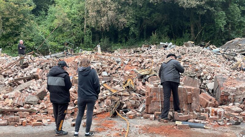 People inspect the rubble remains of The Crooked House pub in Himley, near Dudley, West Midlands (Matthew Cooper/PA)