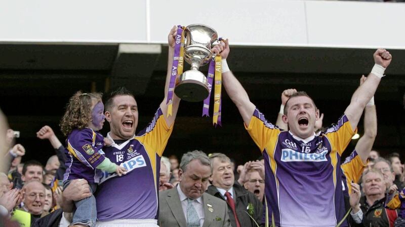 Johnny Magee and Pat Burke celebrate with the Andy Merrigan Cup after Kilmacud&#39;s 2009 All-Ireland club final victory over Crossmaglen. Picture by Hugh Russell 