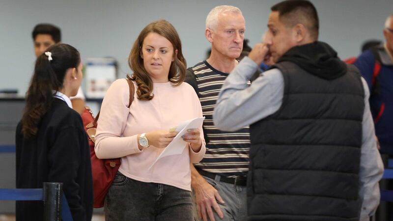 Melissa Reid, centre, walks next to her father William Reid, second right, before boarding a flight in Lima, Peru. Picture by&nbsp;Martin Mejia, Associated Press&nbsp;