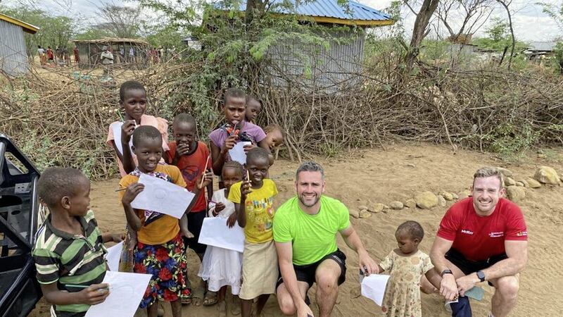 Kevin McKernan of Down and Laois man Kieran Lillis with children during the GPA trip to Kenya in November