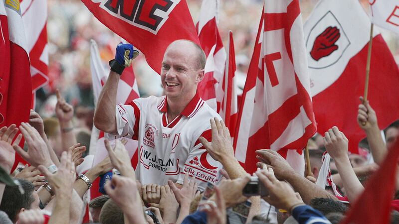 Jubilant Tyrone supporters carry captain Peter Canavan aloft in 2003.