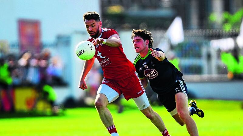 Tyrone skipper Mattie Donnelly evades the attentions of Kildare&rsquo;s Chris Healy during the Red Hands&rsquo; All-Ireland Qualifier win in Newbridge on Saturday evening&nbsp;Picture by Sportsfile