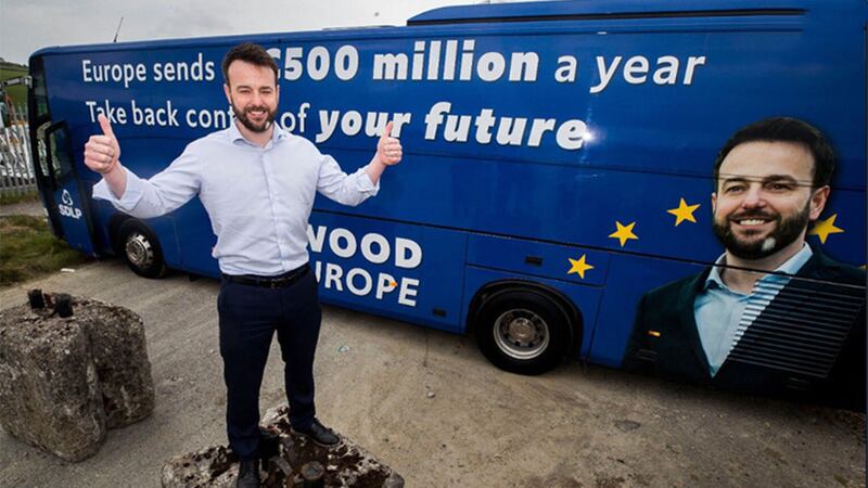 Colum Eastwood unveiled a bus with a positive message about EU money as he launched his campaign for the European election. Picture by PA Wire