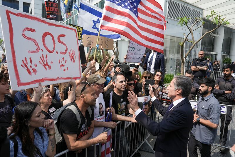 US Secretary of State Antony Blinken speaks to families and supporters of Israeli hostages held by Hamas in Gaza during a protest in Tel Aviv calling for their return (Oded Balilty/AP)