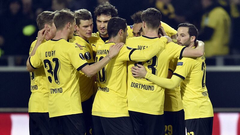 Dortmund's Pierre-Emerick Aubameyang (fourth right) celebrates his opener with his team-mates during Thursday's Europa League last-16 first leg against Tottenham<br />Picture by AP