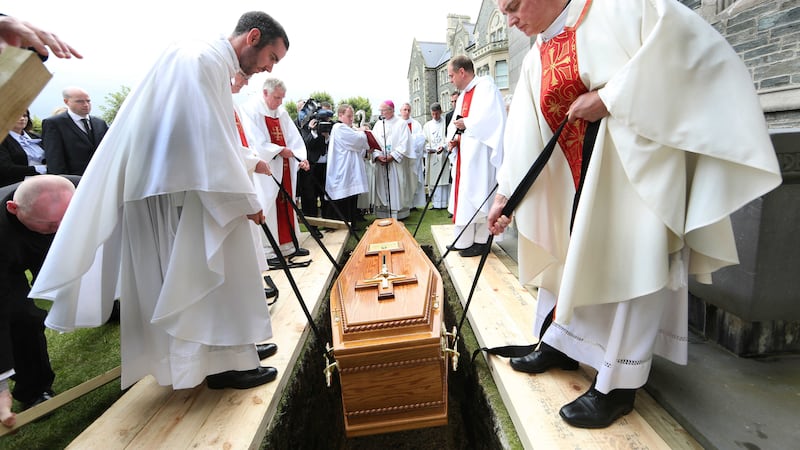 &nbsp;Bishop Edward Daly's coffin is lowered to the ground at St Eugene's Cathedral in Derry