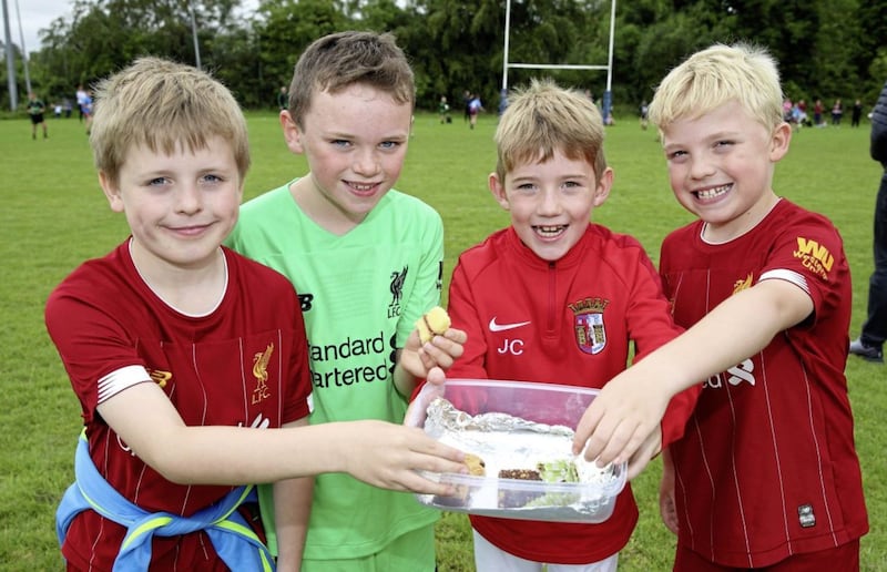 <span style=" font-family: Arial, sans-serif;">Sunday Sept 8 2019: St Brigid's GAC Under 10.5 Football Tournament at Belfast Harlequins RFC. Sharing their lunch are Zak Kerr-Woodrow, Thomas O'Brien, Jamie Craig and Zavier Kerr-Woodrow, from St Brigid's. Picture by Cliff Donaldson.<br /><br /></span>