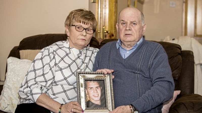 Stephen and Breege Quinn with an image of their murdered son Paul Quinn. Picture by Liam McBurney 