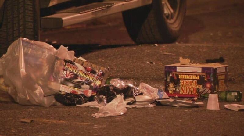 Fireworks boxes and debris litter Meade Street after the shooting