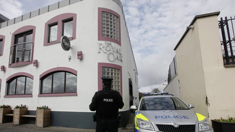 Police at the Royal Oak Bar in Carrickfergus in March. Picture by Ann McManus 