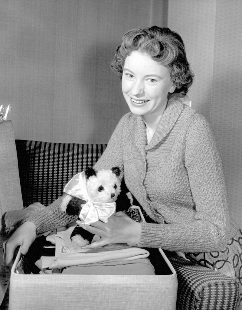 Singer Ruby Murray with her lucky panda mascot as she packs at her London home for her first trip to the United States 