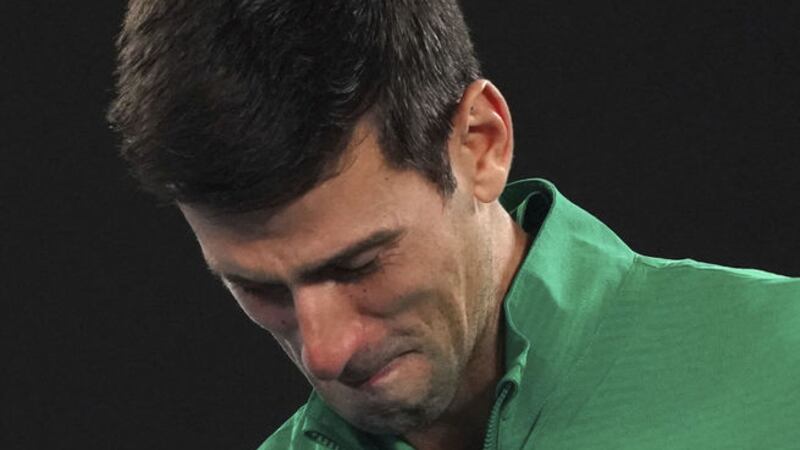 Serbia's Novak Djokovic reacts as he talks about the death of his friend Kobe Bryant as he is interviewed on court following his quarter-final win over Canada's Milos Raonic at the Australian Open tennis championship in Melbourne, Australia on Tuesday Jan 28 2020. (AP Photo/Lee Jin-man)&nbsp;