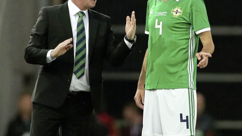 Tom Flanagan with previous Northern Ireland manager Michael O&#39;Neill (left) at Windsor Park in September 2019. 