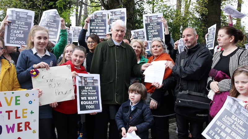 Bishop of Down and Connor Noel Treanor with protesters opposed to the closure of Little Flower school. Picture by Philip Walsh 