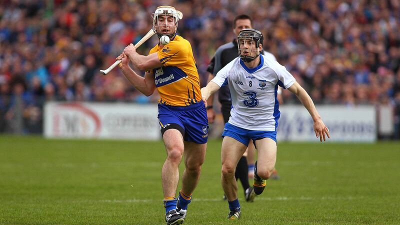 Clare's Conor McGrath comes under pressure from Waterford's Jamie Barron during Sunday's NHL Division One hurling final in Thurles <br />Picture by Seamus Loughran&nbsp;