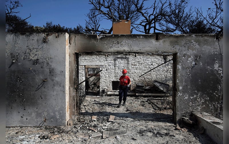 Wildfires in Greece have killed at least 79 people and sent thousands fleeing. Picture by&nbsp;Thanassis Stavrakis, Associated Press