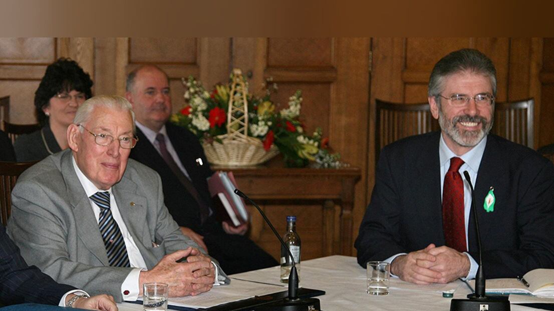 Ian Paisley and Gerry Adams sat next to each other as they confirmed their two parties would share power in the Assembly&nbsp;