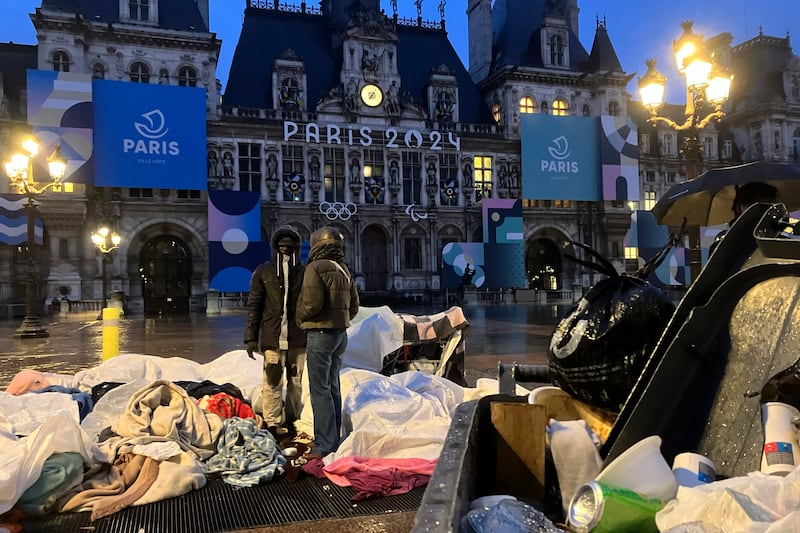 Migrants in front of Paris City Hall (Nicolas Garriga/AP)