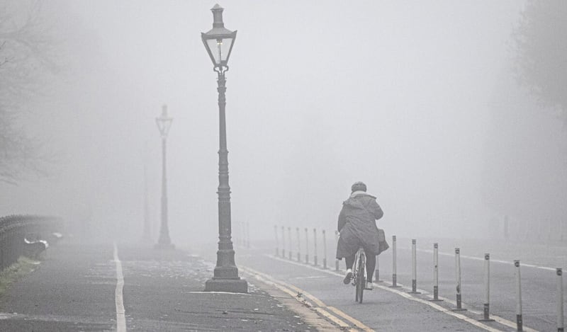 People navigate thick fog in Dublin City as the Irish Met office issued an orange level Freezing fog warning. Picture: PA, December 12 