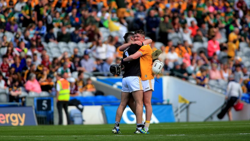 Keelan Molloy (right) and Ryan Elliott embrace after winning the Joe McDonagh Cup in 2020. Both men have opted out of Antrim duty for next year, alongside clubmates Seaan Elliott and Eoin O'Neill as well as St Enda's defender Joe Maskey. Picture by Seamus Loughran