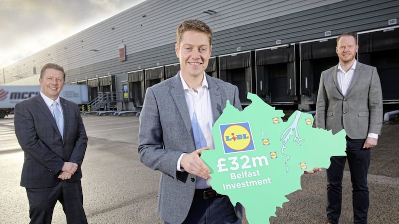 Lidl&#39;s property and construction director, Alan Barry (centre) picture at the retailer&#39;s Nutts Corner distribution centre with Invest NI&#39;s Drew McIvor (left) and Lidl&#39;s regional director in the north, Conor Boyle (right). 