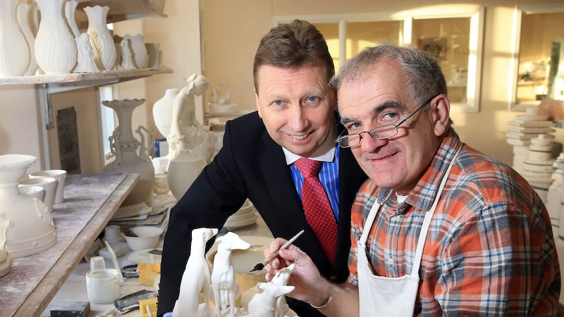 Belleek Group managing director John Maguire looks on as master craftsman Brendan McCauley works on the &lsquo;Group of Greyhounds&rsquo; figurine, first produced in the 1860s 