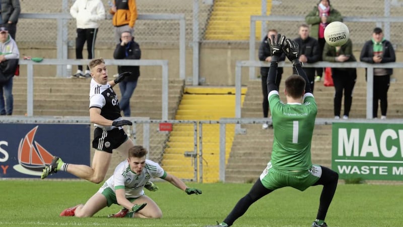 Kilcoo&#39;s Jerome Johnston lashes home an early goal as the Magpies claimed their ninth Down title in 20 years with victory over Burren yesterday. Picture by Philip Walsh 