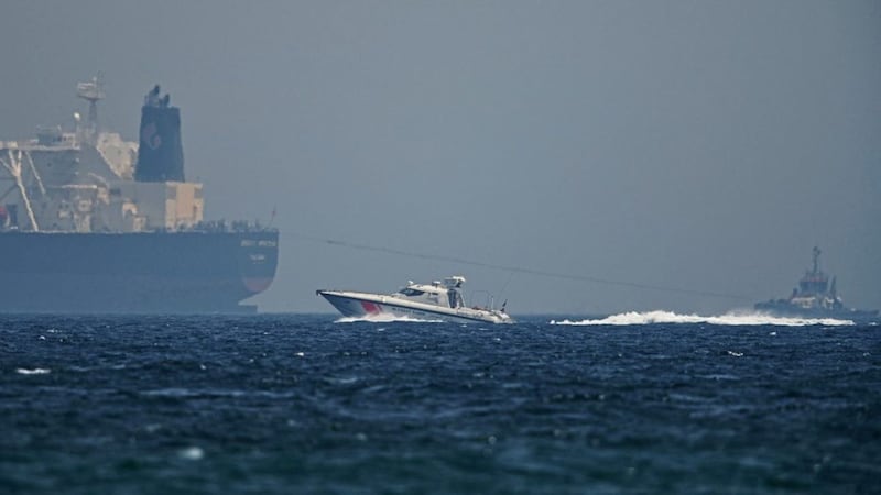 An Emirati coast guard vessel passes an oil tanker off the coast of Fujairah, United Arab Emirates. Picture by Jon Gambrell/AP 