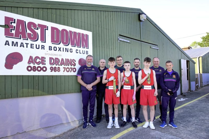 Oisin Mulholland, Bryce Collins and Emmett O&#39;Donnell with the East Down Boxing Club coaches. Picture by Cliff Donaldson 