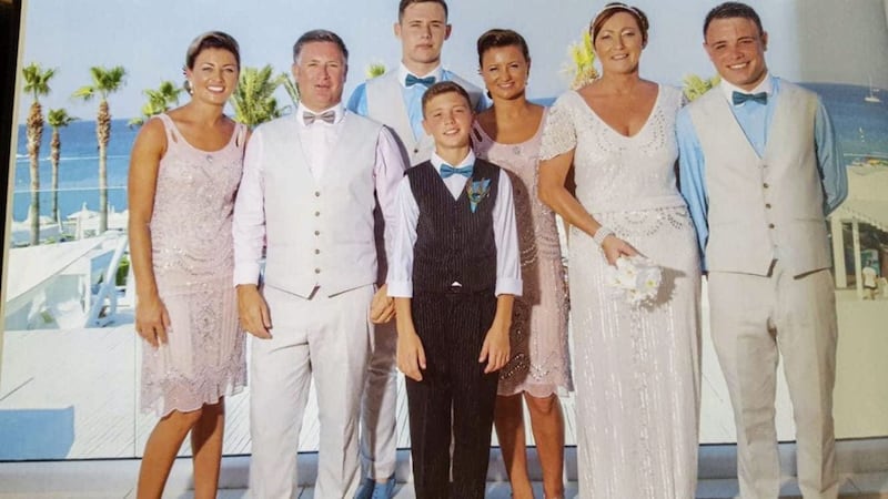 Brian Braiden (second left) and his wife, Carol (second from right) pictured with their four children and grandson at their wedding three years ago in Cyprus 
