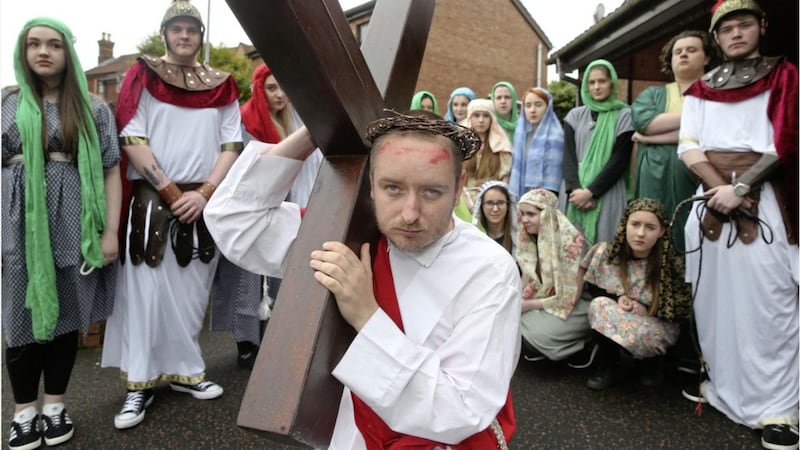 Young people took part in a procession from St Louis House in west Belfast to nearby St Michael&#39;s Church to mark Good Friday. Picture by Hugh Russell 