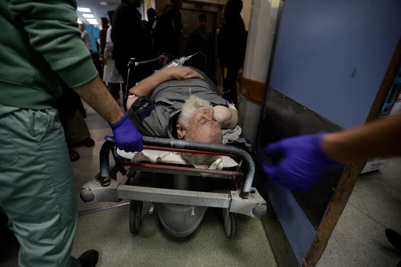 Palestinians wounded in Israeli air strikes arrive at the Nasser hospital in the town of Khan Younis (AP Photo/Mohammed Dahman)
