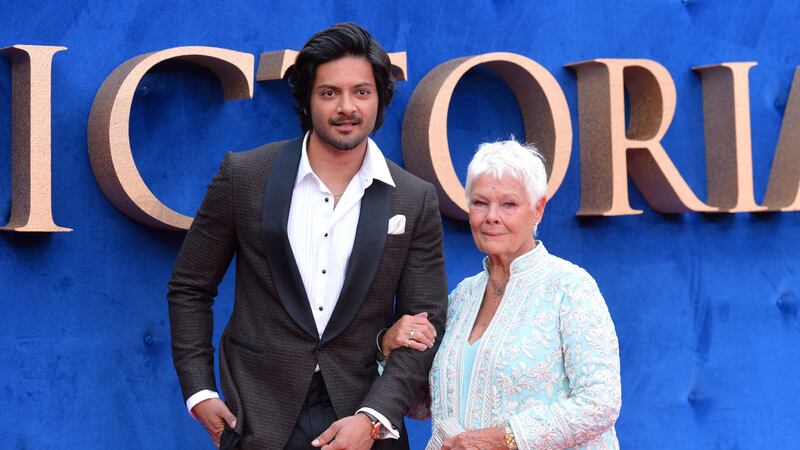 Dame Judi dazzled in a floor-length blue and white outfit as she took to the red carpet for the premiere of Victoria And Abdul.