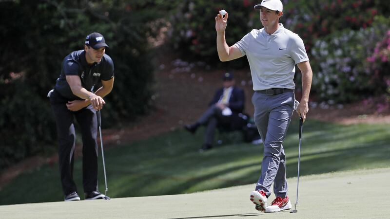 Rory McIroy holds up his ball after a birdie on the 13th hole during the second round of the US Masters golf tournament in Augusta, Georgia. Picture by AP Photo/David J. Phillip).
