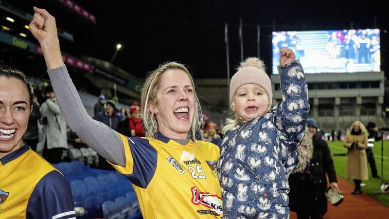 Clonduff&#39;s Ursula Kearney celebrates winning the AIB All-Ireland Intermediate Club Camogie Championship final with her daughter at Croke Park on Saturday Picture: Evan Treacy/Inpho 