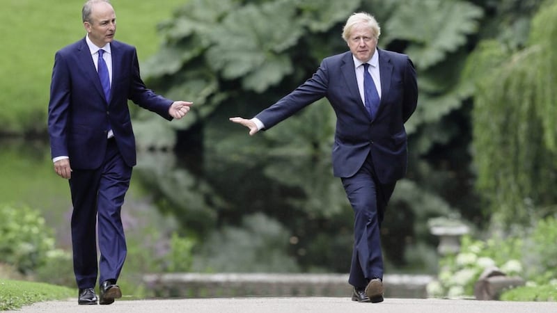 Prime Minister Boris Johnson (right) with Taoiseach Miche&aacute;l Martin in the gardens at Hillsborough Castle during the Prime Minister&#39;s visit to Belfast last August. Picture by Brian Lawless/PA Wire 